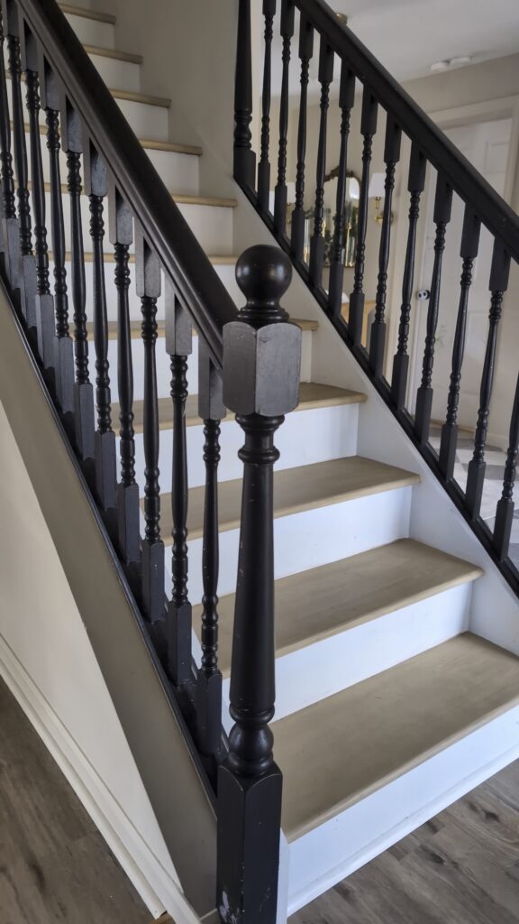 black painted staircase before wood look transformation
